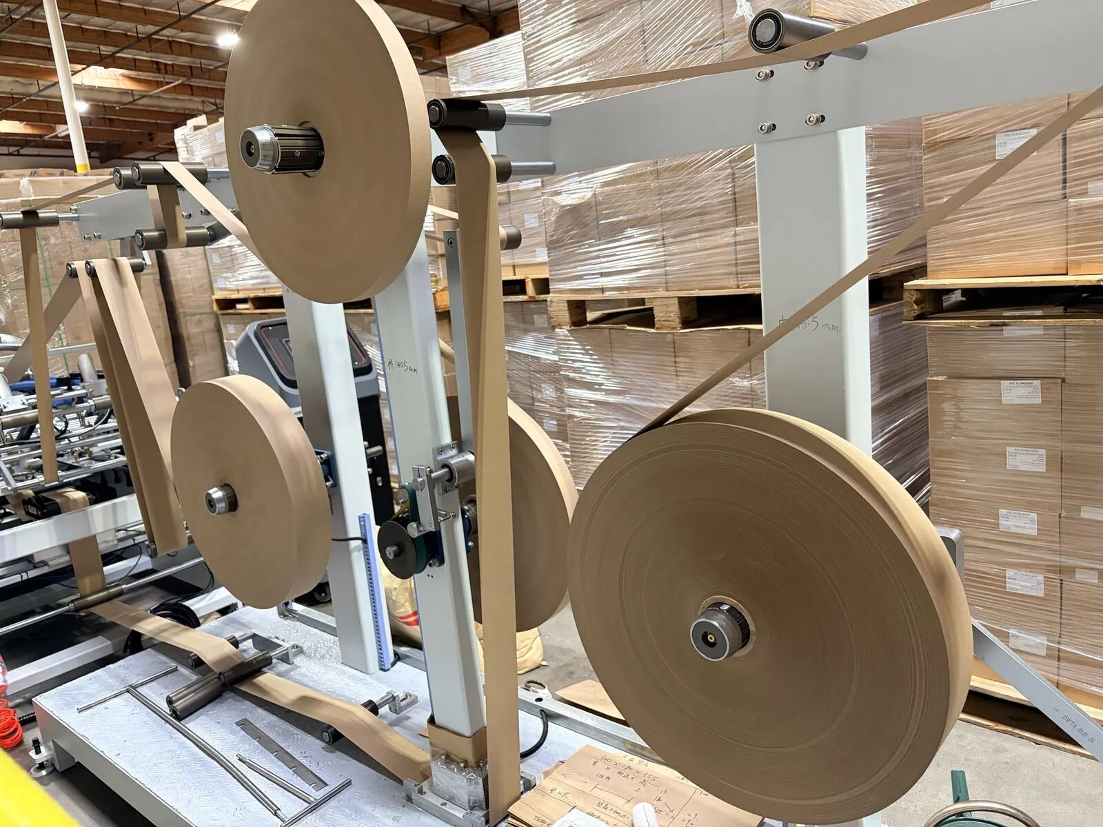 Paper feed rolls on production line